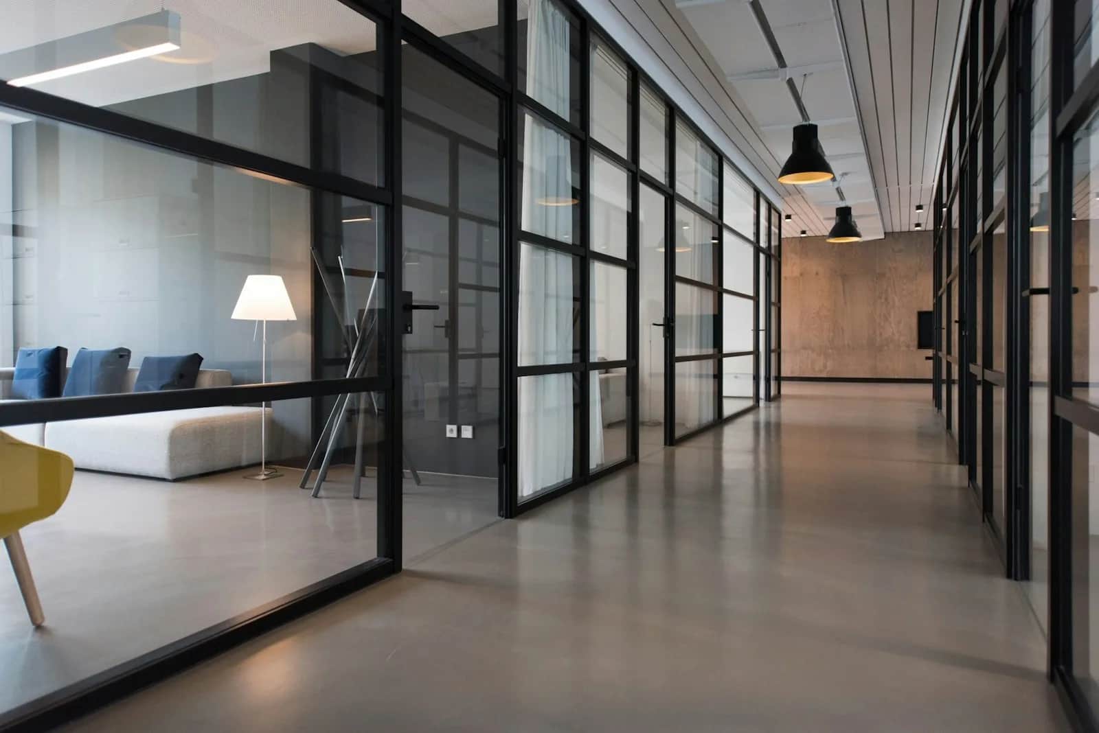 Quiet workspace with a timber desk, shelving and natural light
